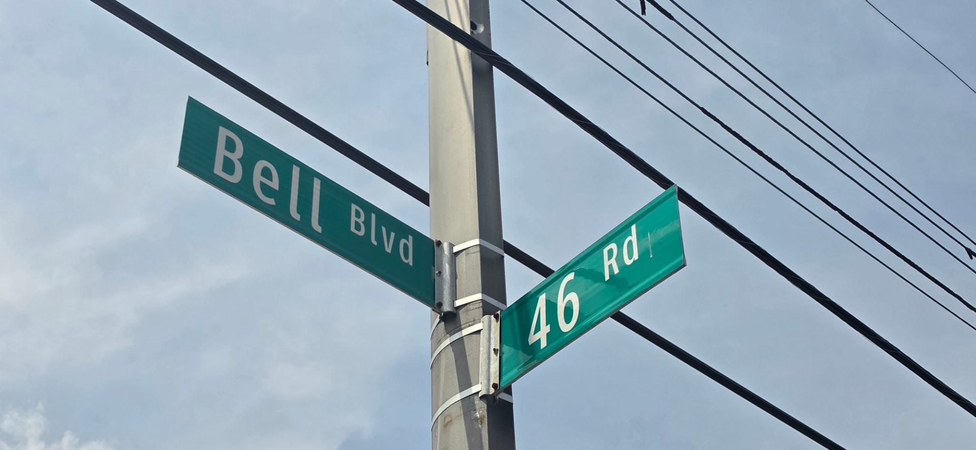 Street signs for Bell Boulevard and 46th Road in Bayside, Queens